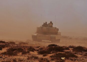 An armoured vehicle and crew during a desert training exercise in Morocco